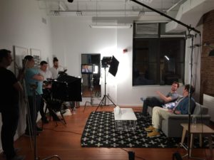 video production crew filming an interview
